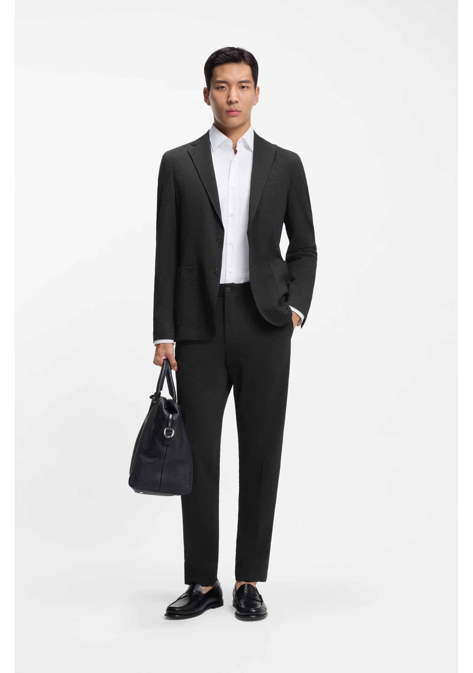Tapered-fit trousers in stretch seersucker