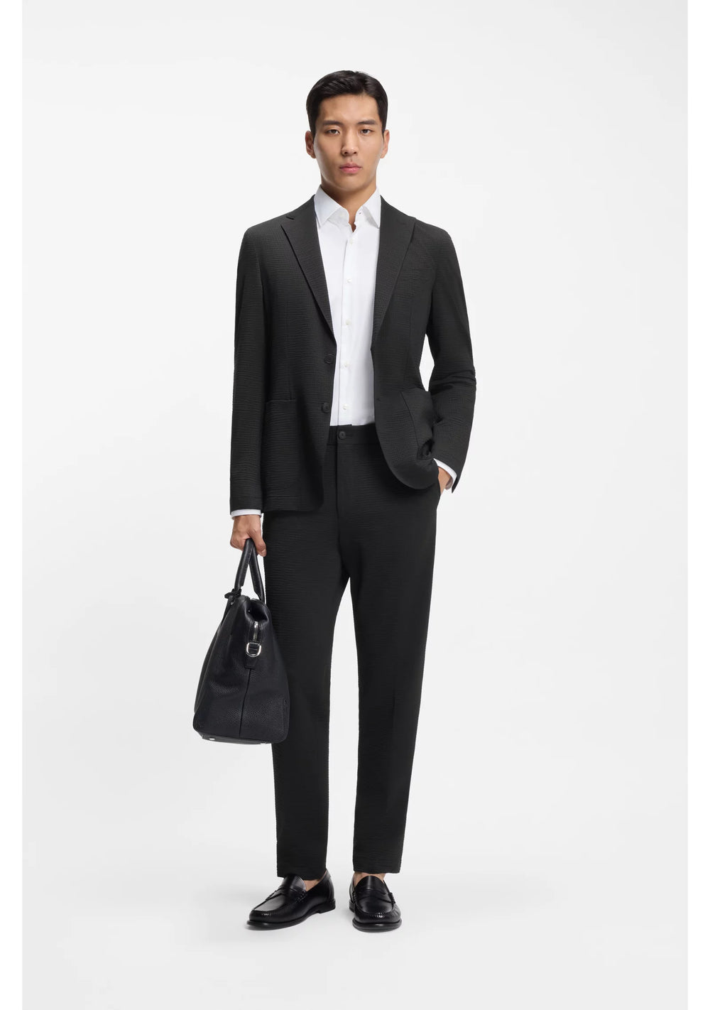 Tapered-fit trousers in stretch seersucker