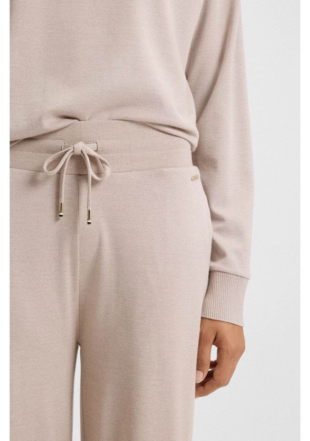 Melange-jersey tracksuit bottoms with logo plate
