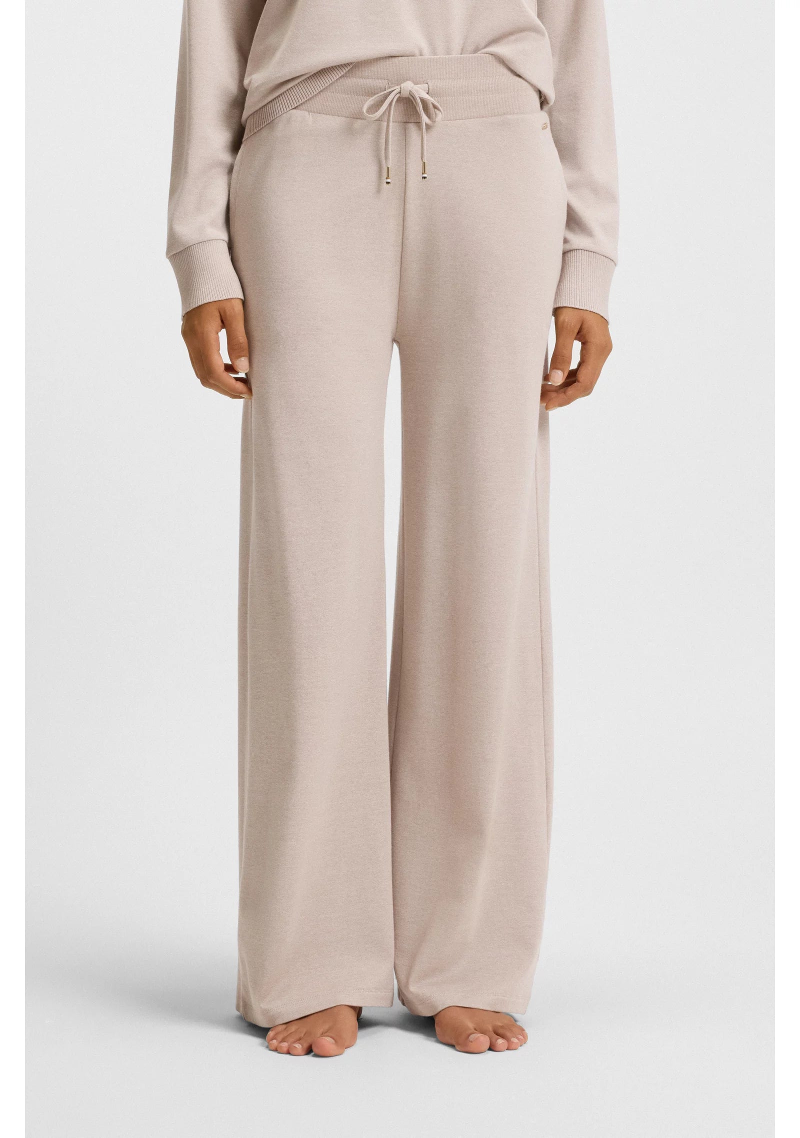 Melange-jersey tracksuit bottoms with logo plate