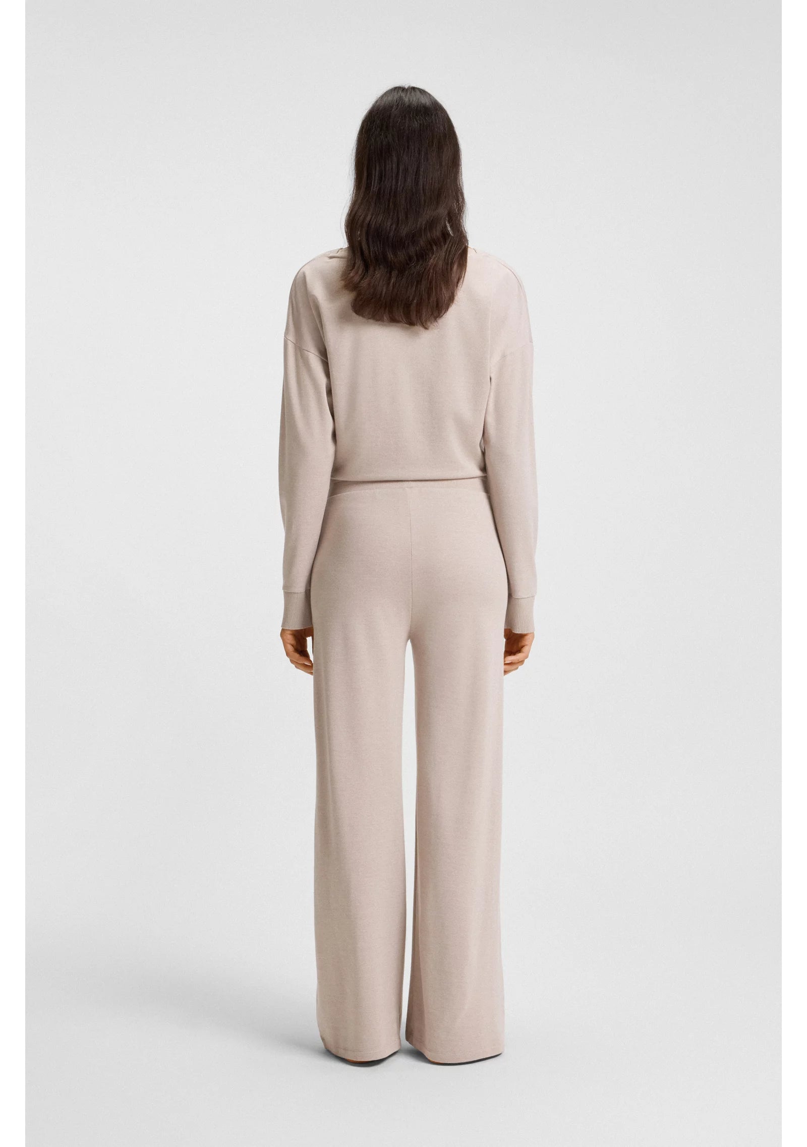 Melange-jersey tracksuit bottoms with logo plate