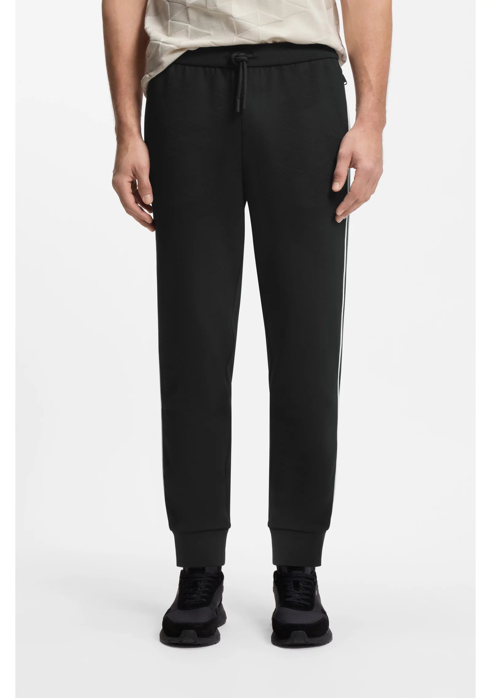 Triangle-jacquard tracksuit bottoms with rubberised logo